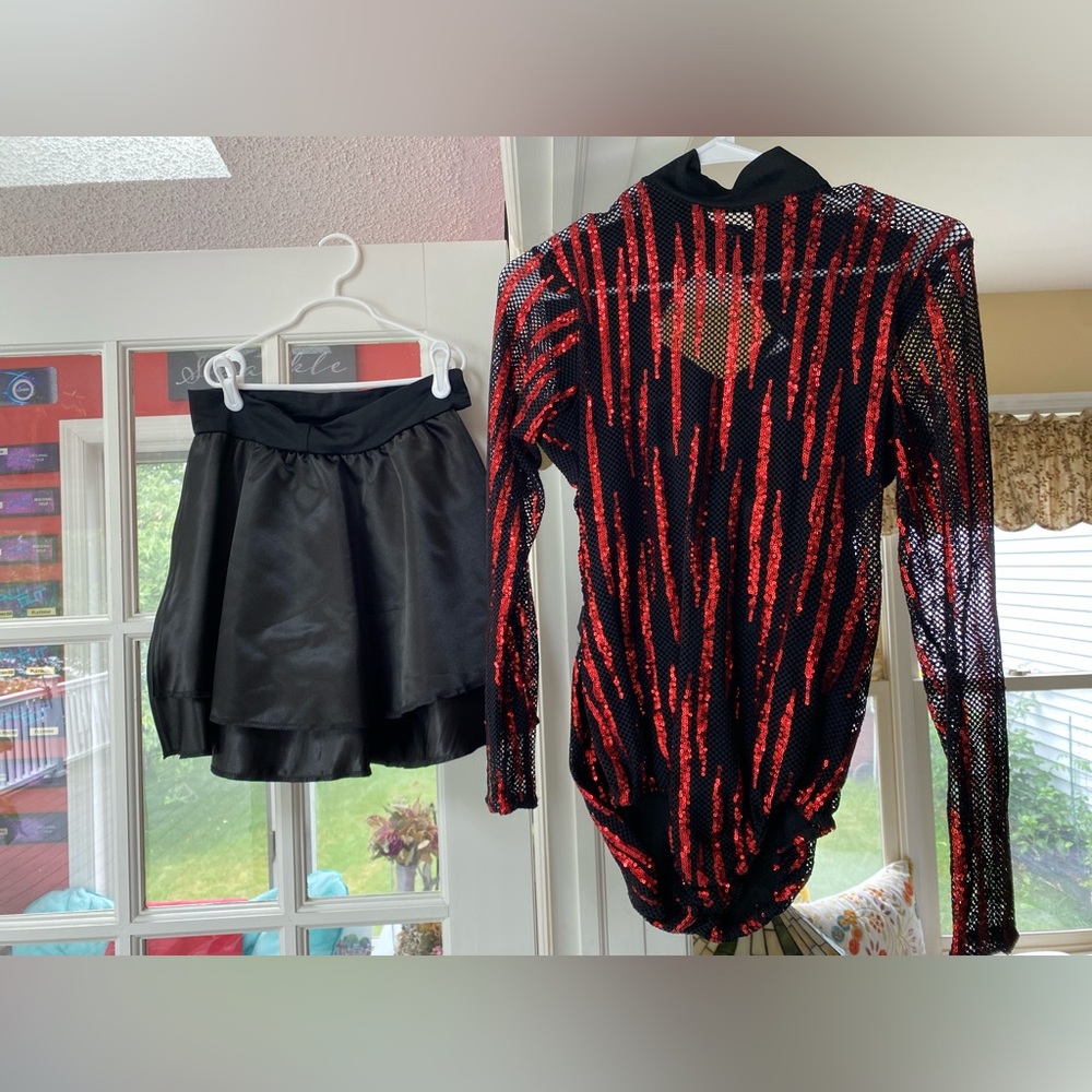 Adult Medium red and black sequin leotard with satin black skirt.